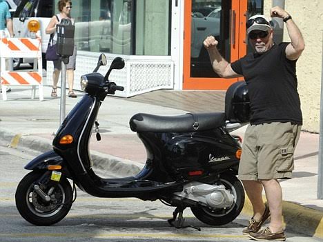 February 7, 2011: Billy Joel is seen having lunch and walking on Lincoln Road Mall before departing on his Vespa scooter in Miami Beach, Florida. Credit: INFphoto.com Ref: infusmi-11/13|sp|
