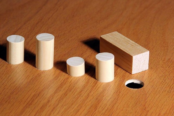 Square peg and a round hole. Metaphor for a misfit or nonconformist.
