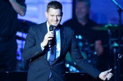 PHOENIX, AZ - APRIL 12: Honoree and singer Michael Buble performs onstage during Muhammad Ali's Celebrity Fight Night XX held at the JW Marriott Desert Ridge Resort & Spa on April 12, 2014 in Phoenix, Arizona. (Photo by Ethan Miller/Getty Images for Celebrity Fight Night)